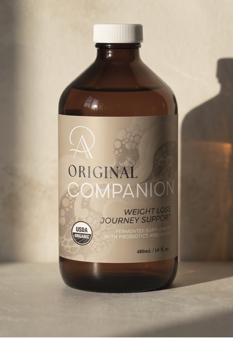 Brown bottle with a label on a beige background