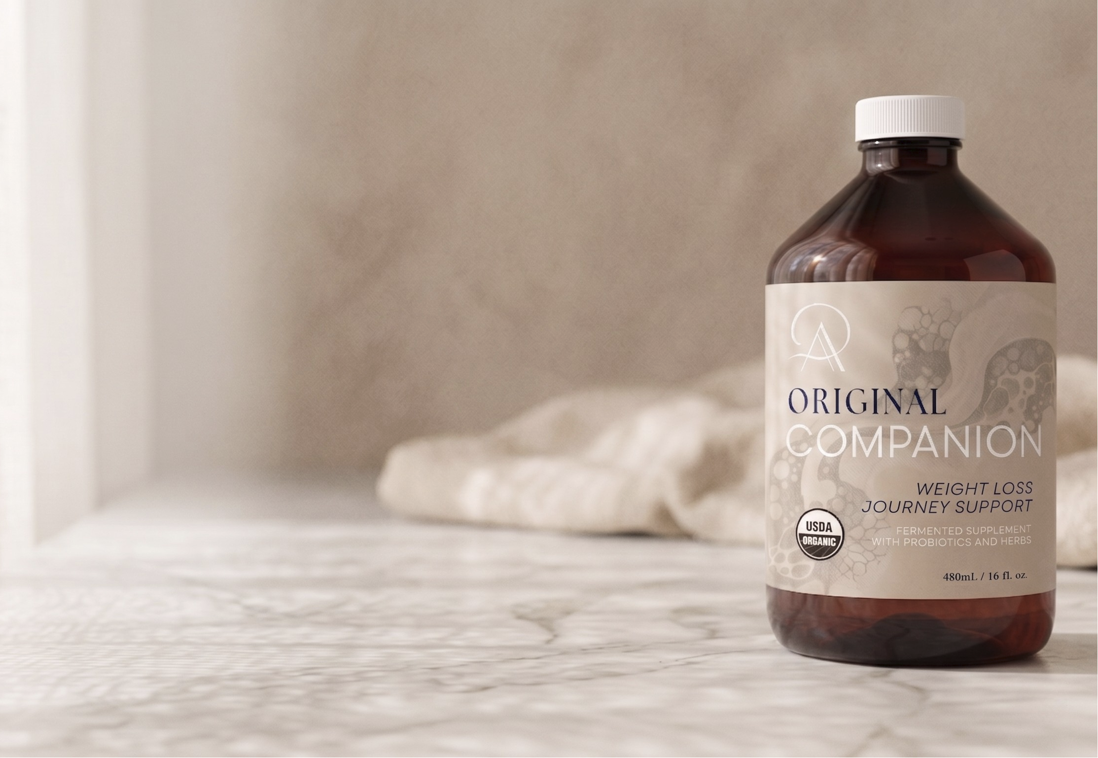 Bottle of 'Original Companion' on a textured surface with a neutral background