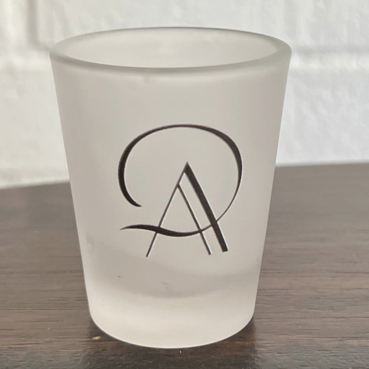 Frosted shot glass with Original Age logo on front and Tablespoon measuring system on back