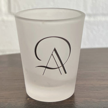 Frosted shot glass with Original Age logo on front and Tablespoon measuring system on back